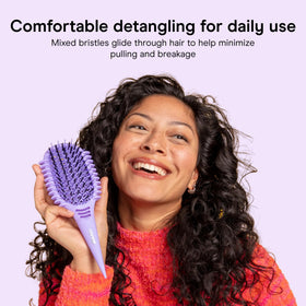 Conair built-in sectioning handle separating hair for precise styling control