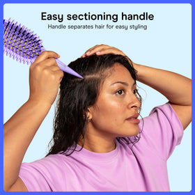 Conair brush held in hand showing scale for comfortable long-hair use