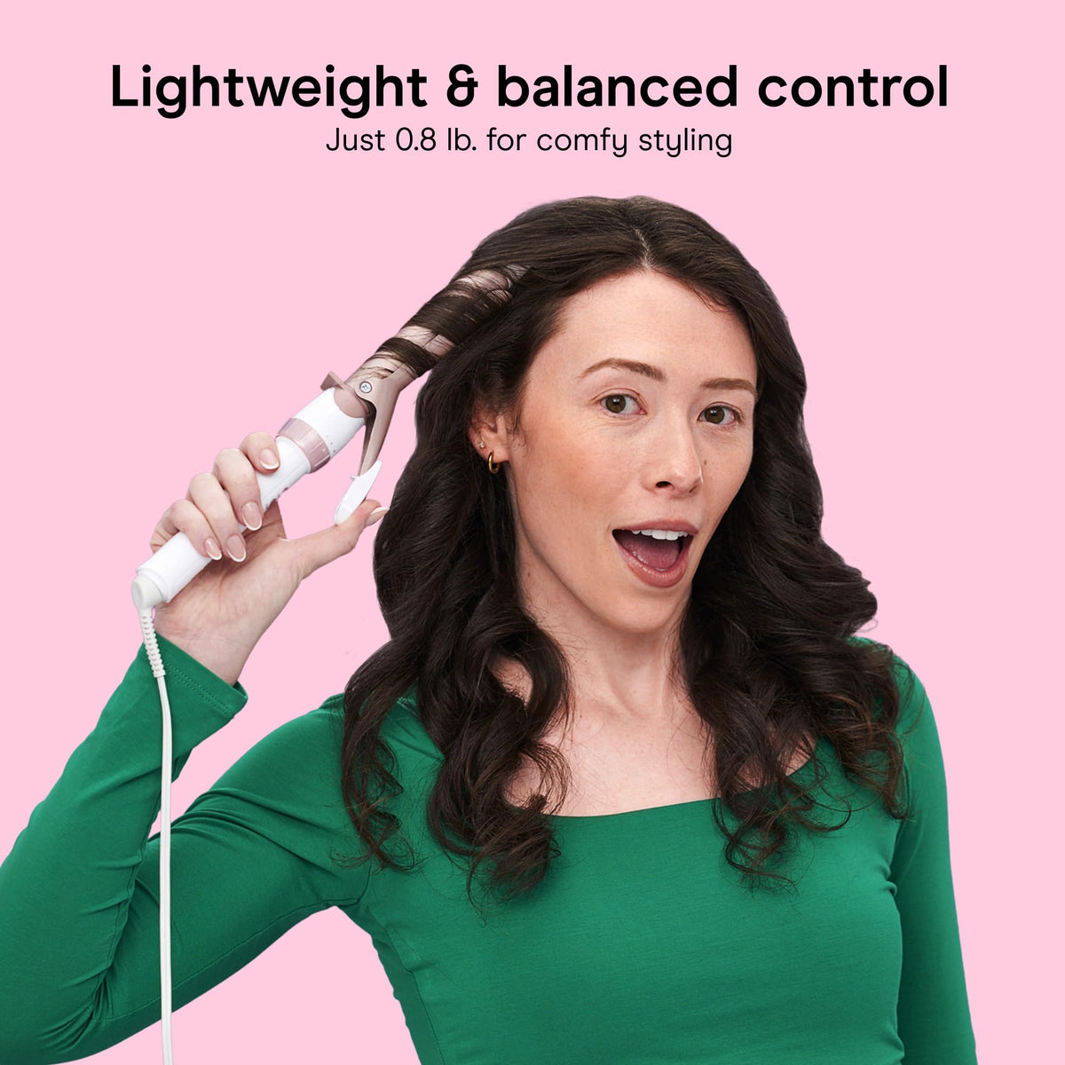Conair curling iron in use on long hair delivering even heat and defined waves