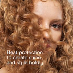 Conair curling iron alongside passport and bag showing Dual Voltage travel benefit