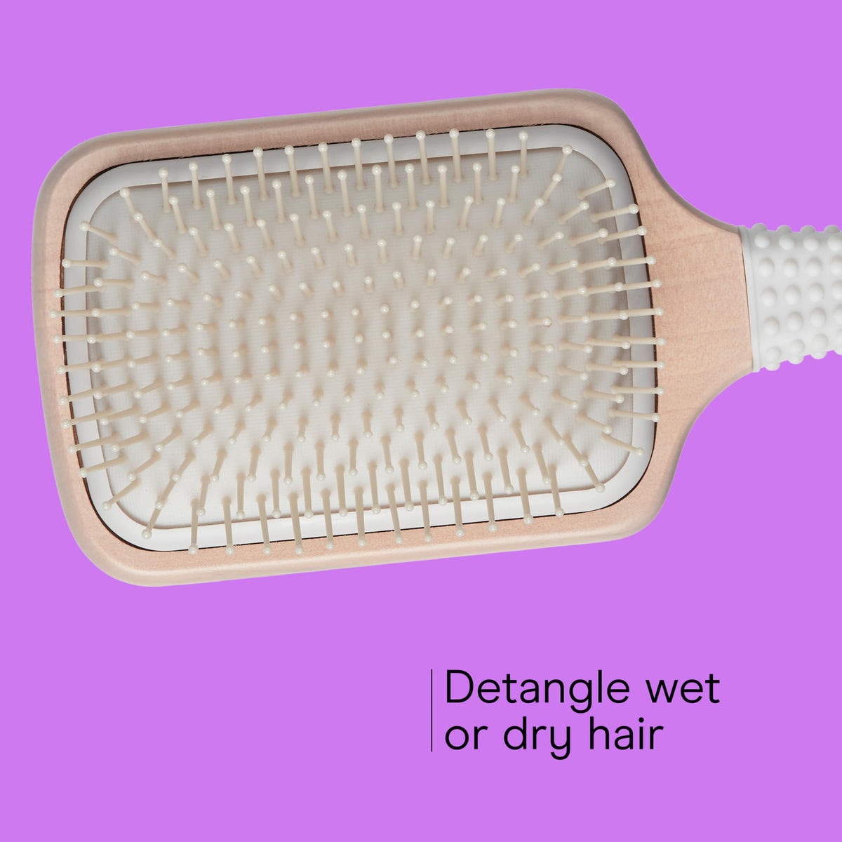 Conair cushioned base side view providing flexible, comfortable brushing