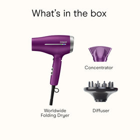 Conair placed beside suitcase to show scale and travel-friendly footprint