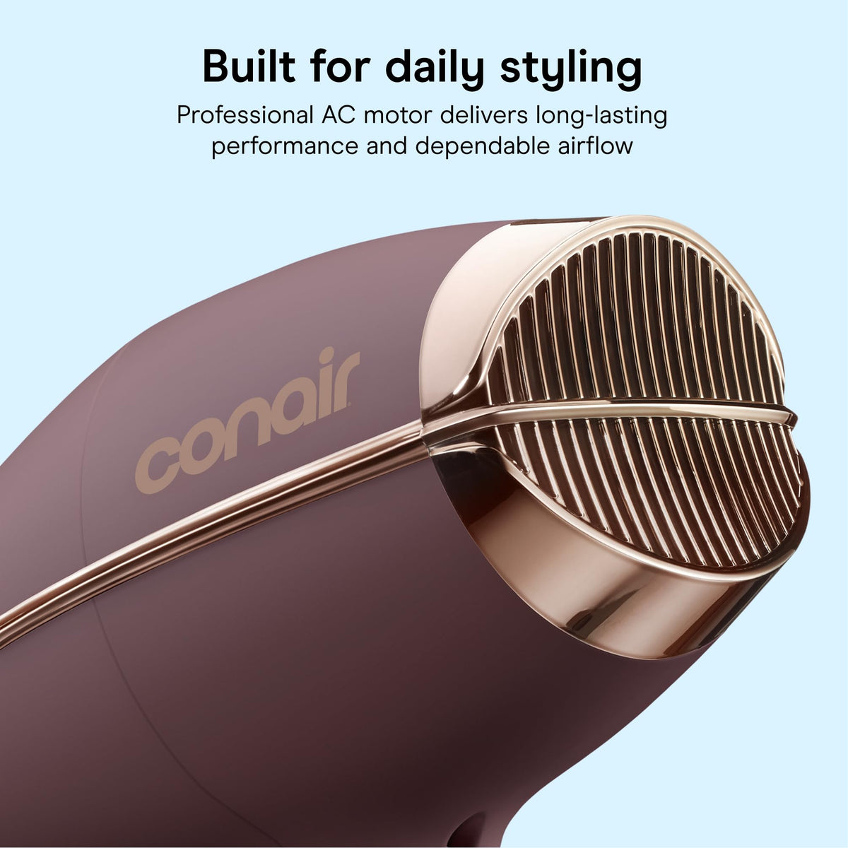 Conair dryer in use on curly hair for defined, frizz-controlled results