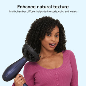 Conair dryer in use on curly hair to define waves and reduce frizz