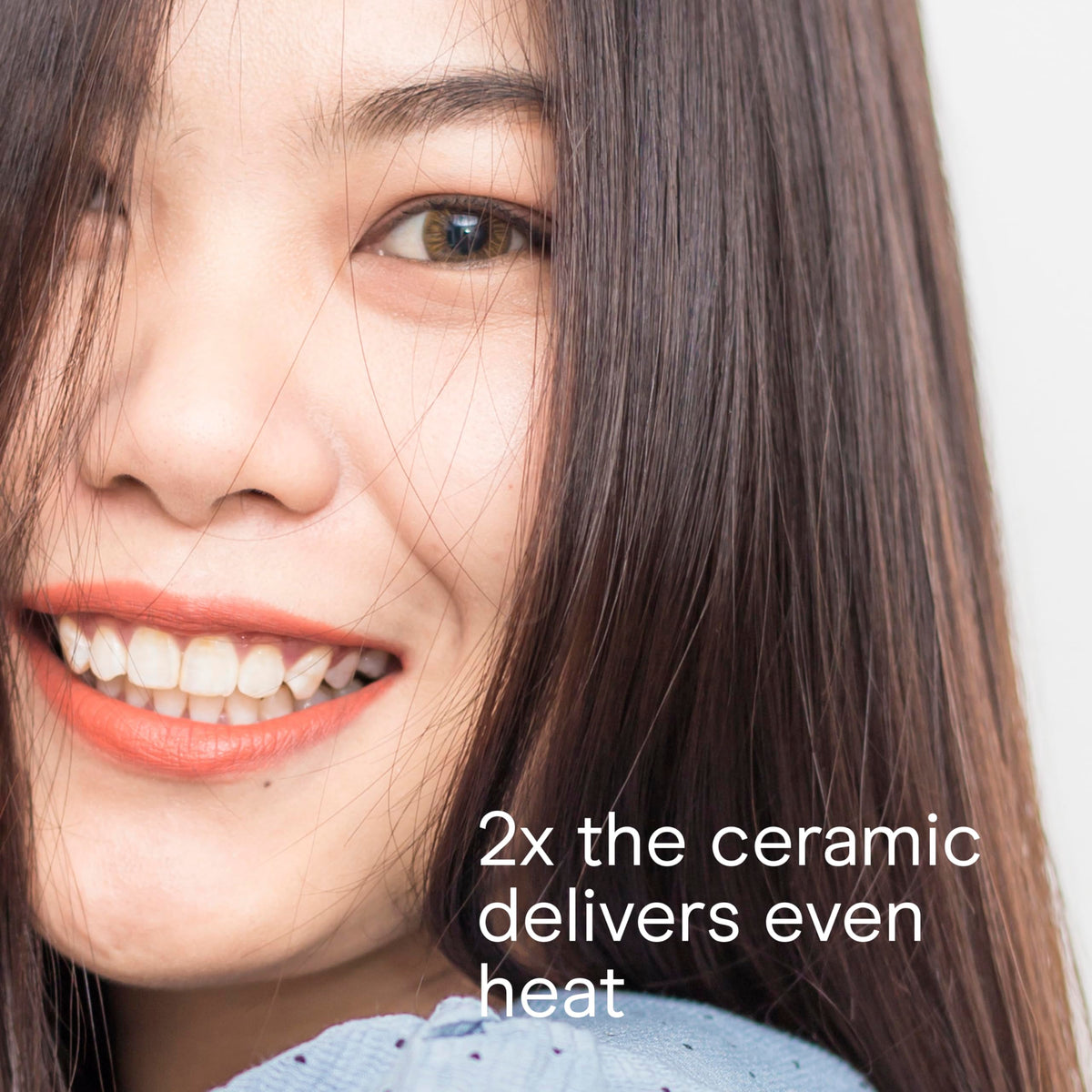 Conair flat iron held in hand styling hair demonstrating ergonomic grip and quick heat-up convenience