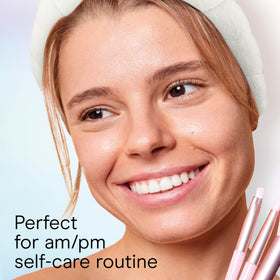 Conair headband in use while washing face for splash protection benefit