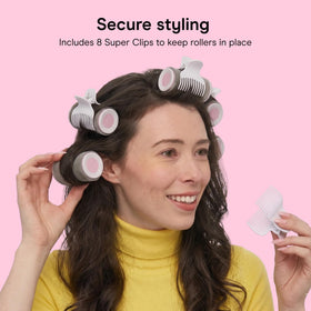 Conair hot rollers being used on hair to create voluminous waves and lift