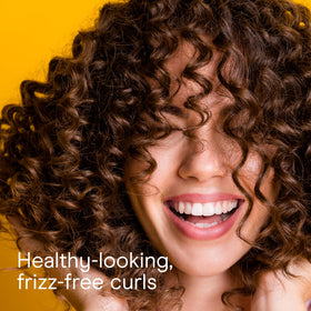 Conair rollers beside ruler showing size options for varied curls