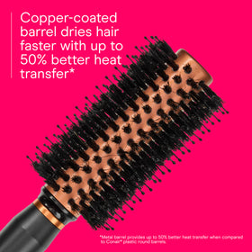 Conair brush held in hand for scale showing comfortable grip and manageable size