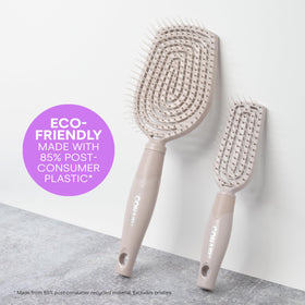 Conair brush in use on wet hair to detangle and reduce breakage