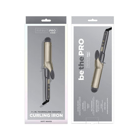 Conair INFINITIPRO held in hand to show 1.5-inch barrel size and scale