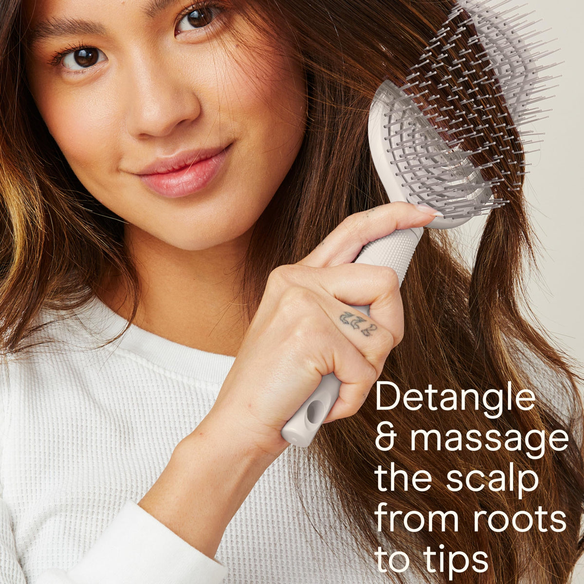 Conair midsize slim cushion close-up highlighting bristles and compact convenience