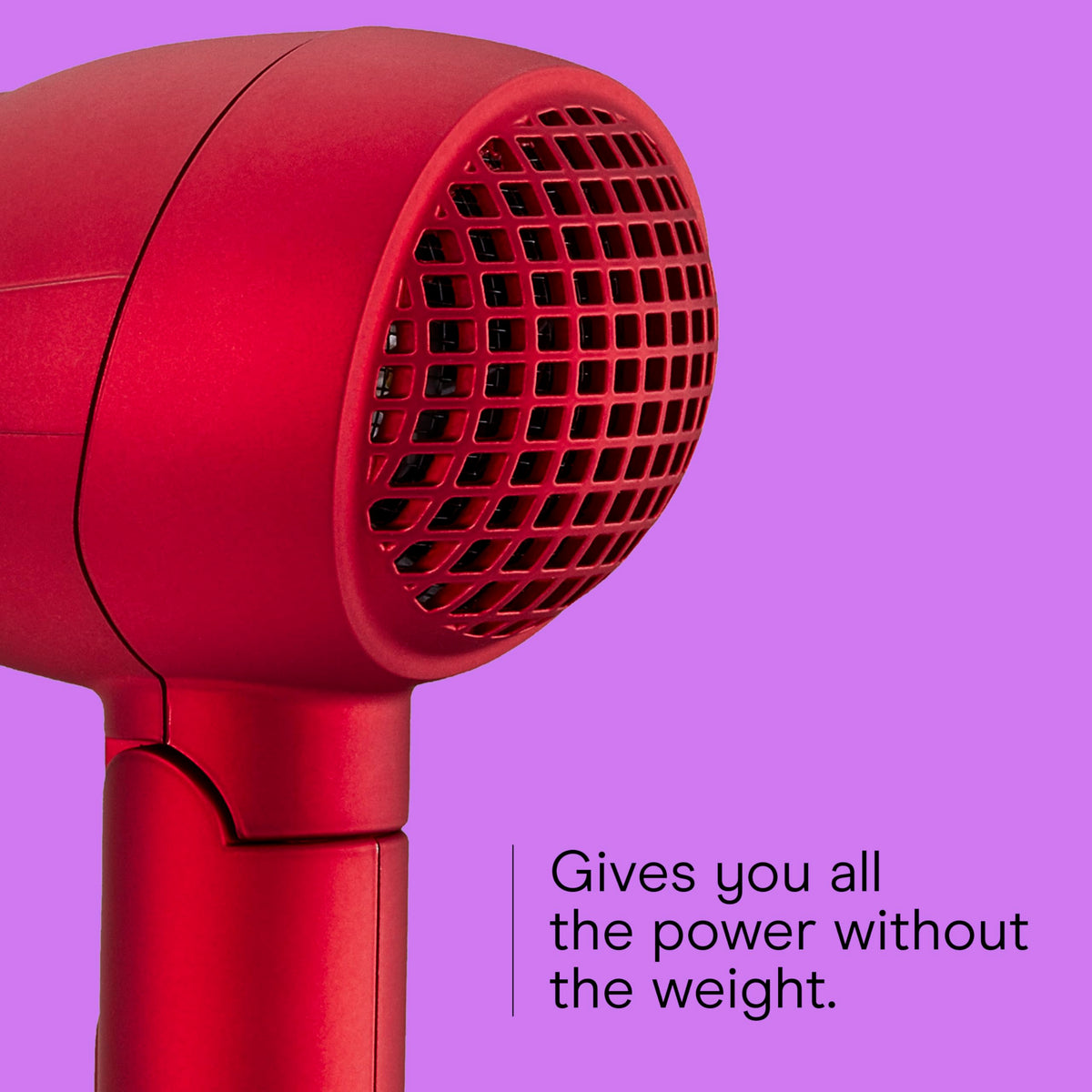 Hand holding Conair Mini Pro demonstrating compact size and comfortable grip