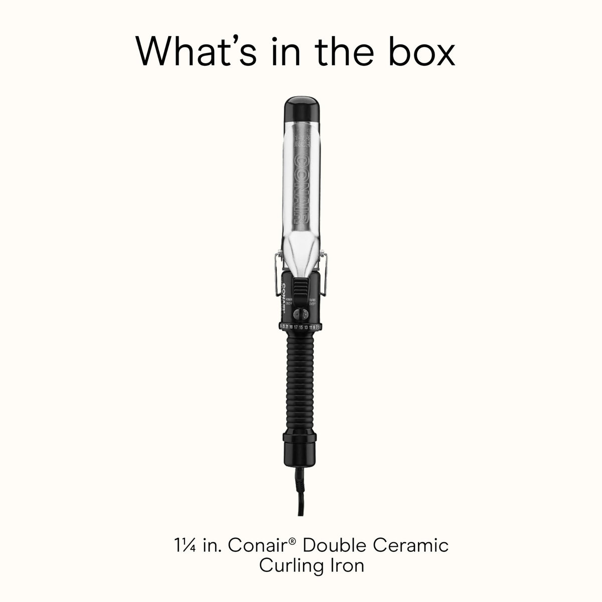 Conair curling iron held in hand to show barrel length and scale benefit
