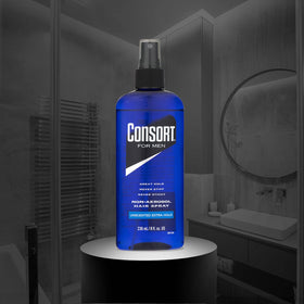 Consort 8 oz bottle held in hand to show compact travel size