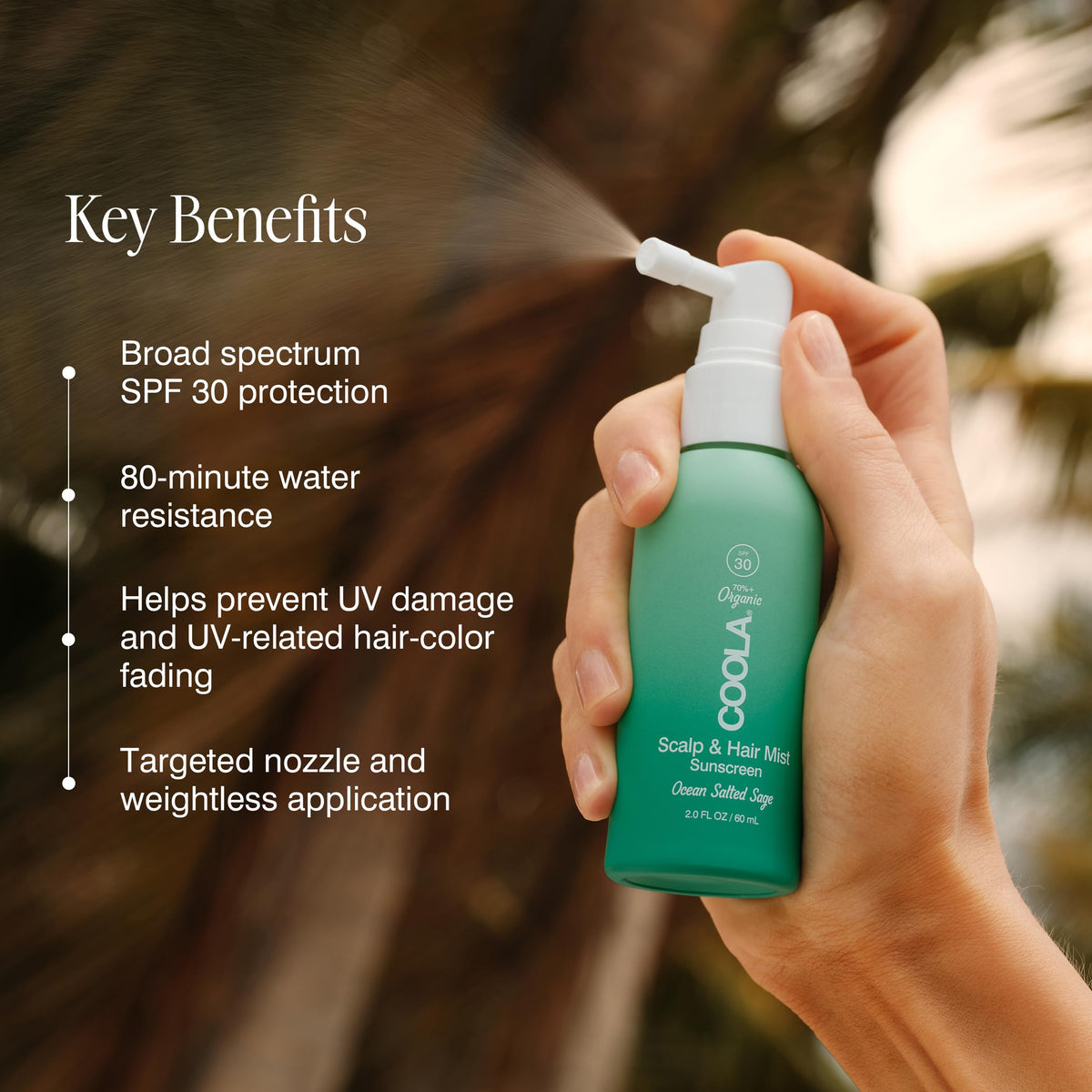 COOLA hand applying scalp spray for targeted sun protection