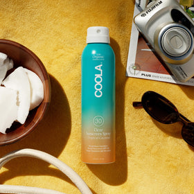 COOLA clear finish on arm showing fast absorbing, non-greasy benefit