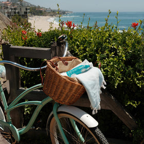 COOLA packed in a tote bag illustrating travel-friendly protection benefit