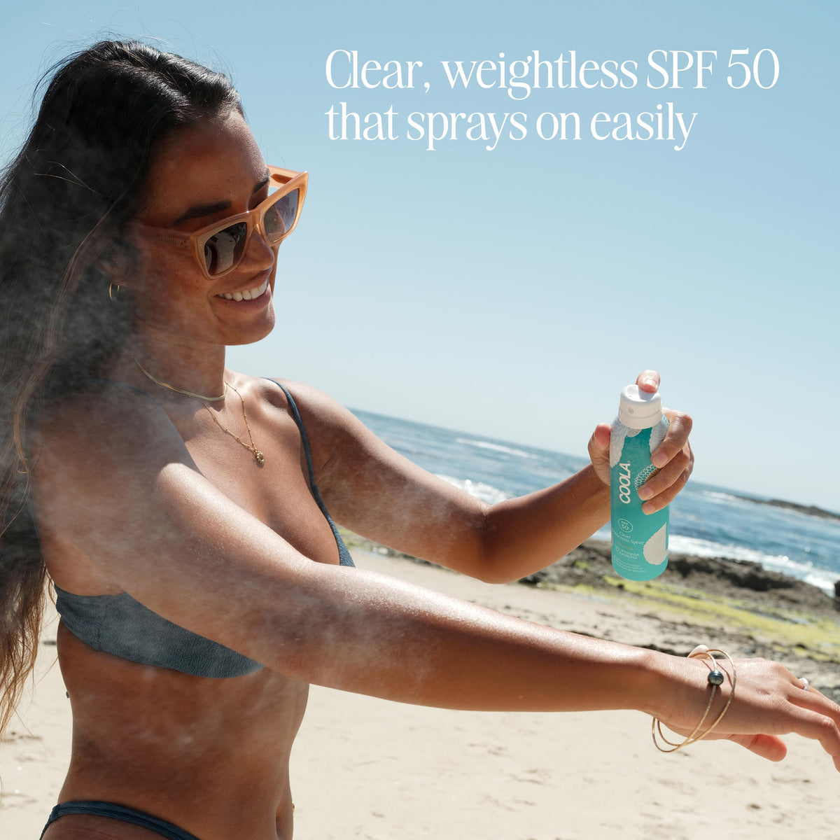 COOLA spray action demonstrating continuous non-aerosol application benefit