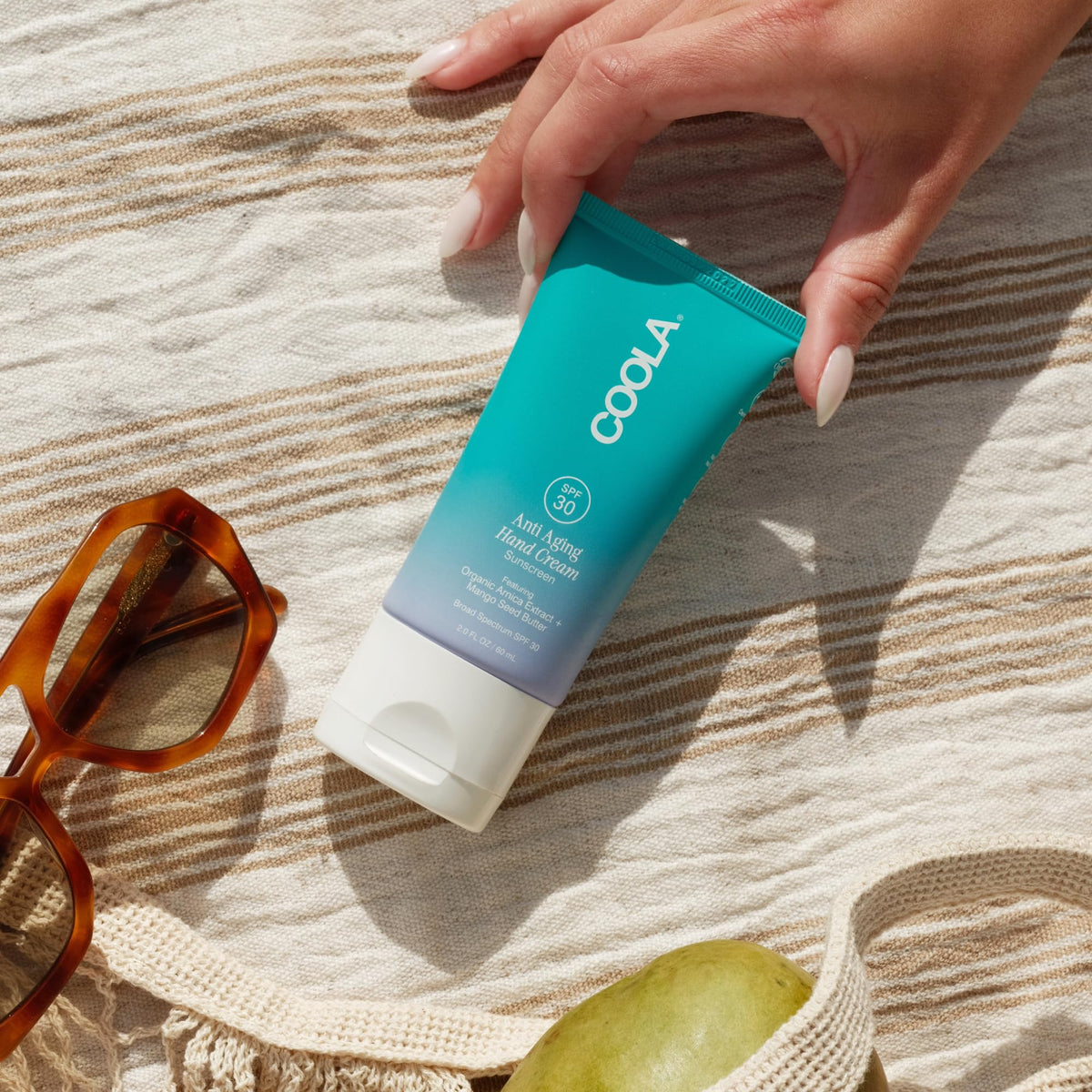 COOLA organic arnica extract visual emphasizing soothing and calming