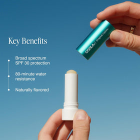 COOLA Liplux clear texture gloss finish illustrating non-tinted feel