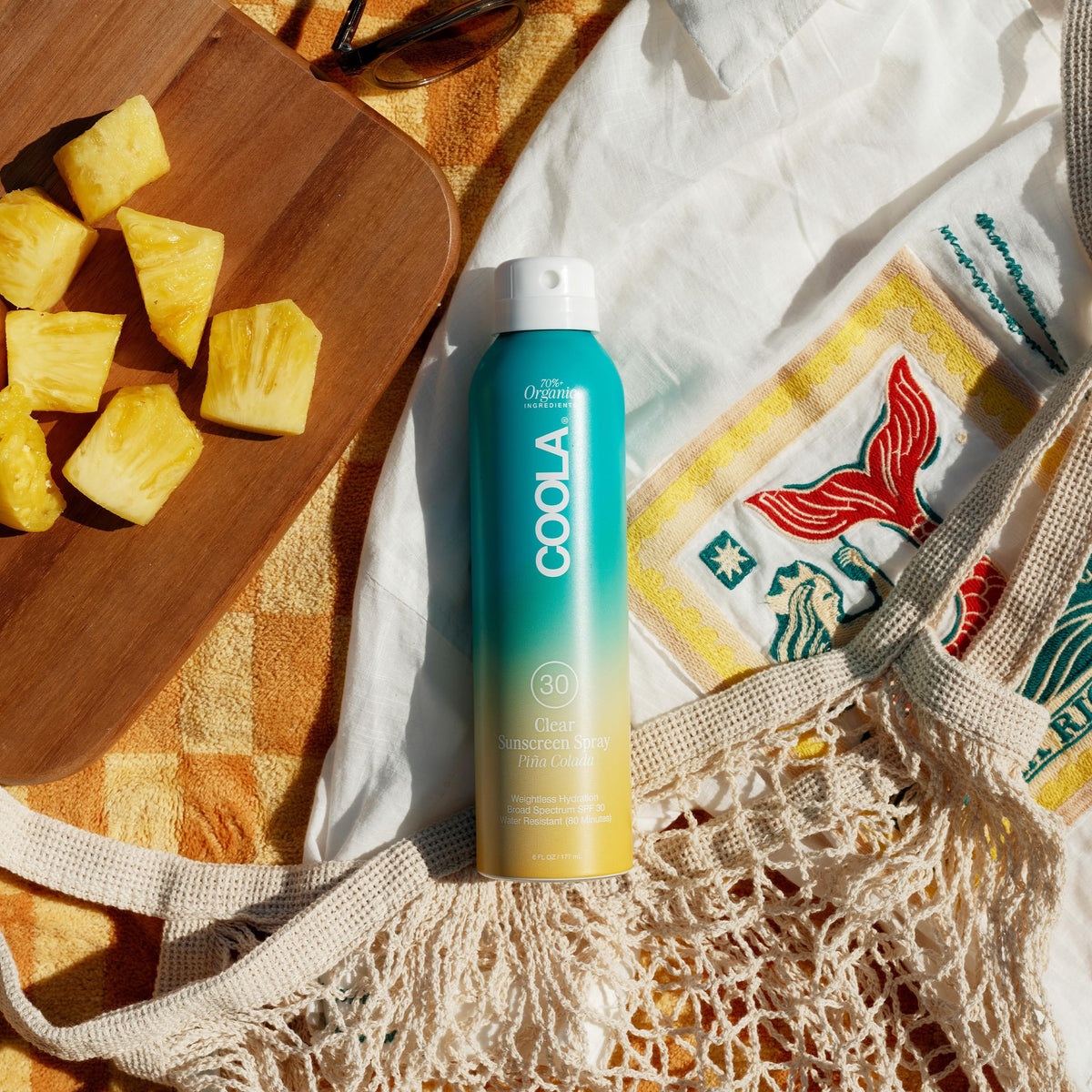 COOLA sheer finish close-up showing non-greasy texture and fast absorption benefit