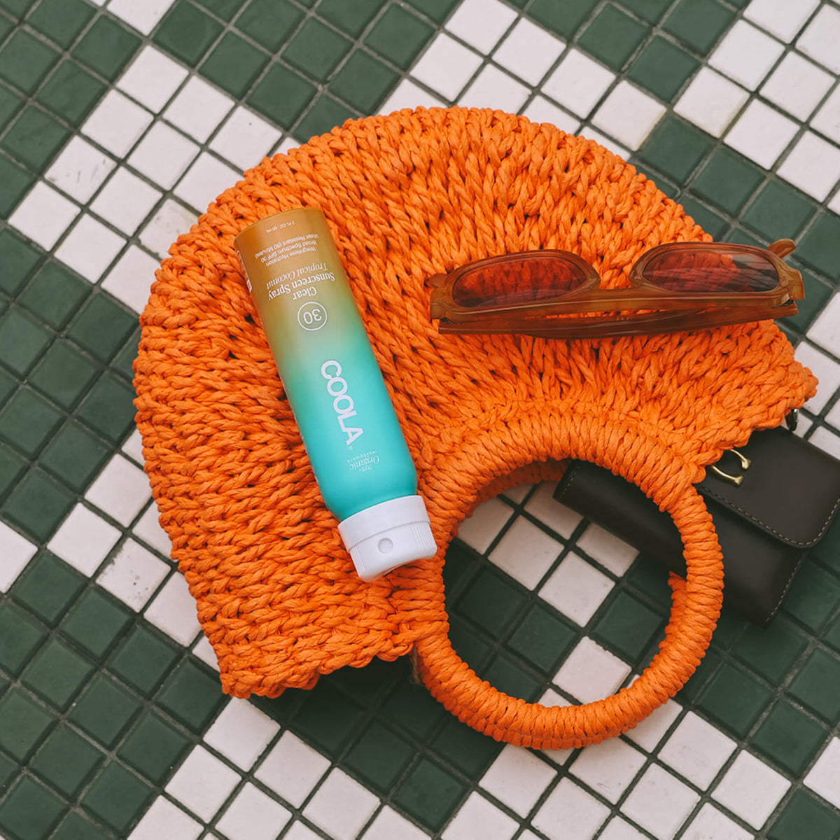 COOLA spray nozzle close-up demonstrating even, fine mist application
