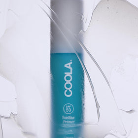 COOLA primer swatched on hand showing lightweight spreadability