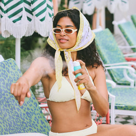 COOLA sunscreen applied on arm demonstrating quick-absorbing finish