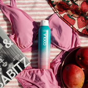 COOLA spray texture on skin showing lightweight absorbency and non-greasy finish benefit