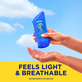 Coppertone being smoothed on arm showing easy absorption and moisturizing benefit