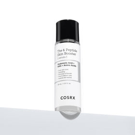COSRX serum being pressed onto skin demonstrating easy layering benefit
