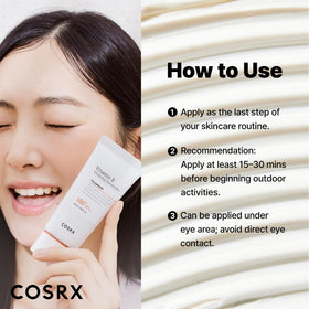 COSRX tube on a beach towel indicating travel-ready sun protection