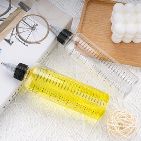 Cosywell bottle held in hand to show 8.5oz scale and ergonomic size for salon use