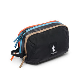 Cotopaxi Nido accessory bag front view in CADA Dia black showing durable exterior and grab handle benefit