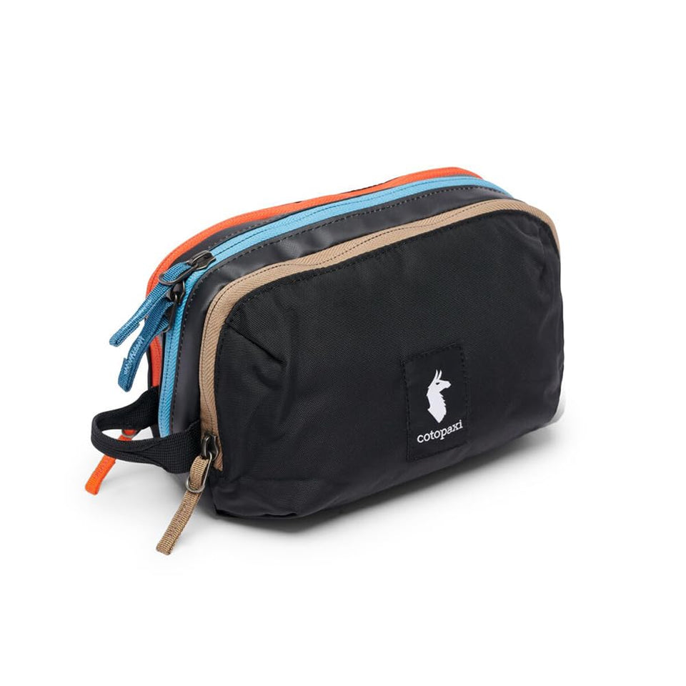Cotopaxi Nido accessory bag front view in CADA Dia black showing durable exterior and grab handle benefit