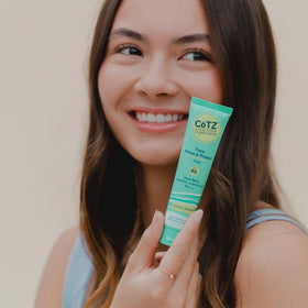 CoTZ application on face with fingers illustrating easy blending and primer effect