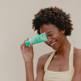 Person using CoTZ outdoors for everyday sun protection on sensitive skin