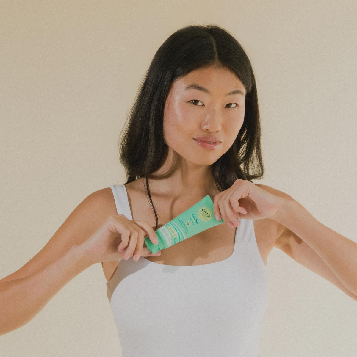 CoTZ tube cap and label highlighting zinc oxide mineral sunscreen