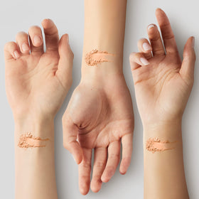 COVERGIRL applying powder with puff to reduce shine and blur pores