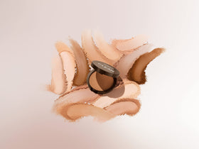 COVERGIRL compact held in hand to show 0.38oz travel-friendly size