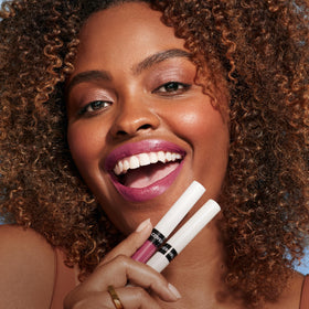COVERGIRL on model smiling, showing lasting color in real life
