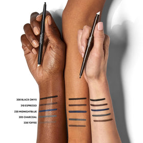 COVERGIRL eyeliner beside coin showing compact size and portability