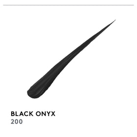 COVERGIRL pen next to common items showing compact size for travel ease
