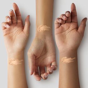 Applying COVERGIRL powder with brush for quick touch-up and matte control