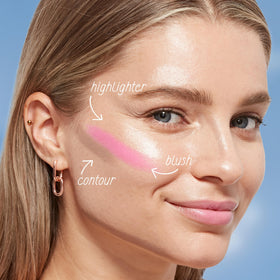 COVERGIRL TruBlend held in hand showing compact size and portability