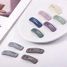 Cptots clips held in hand to show scale and easy portability benefit