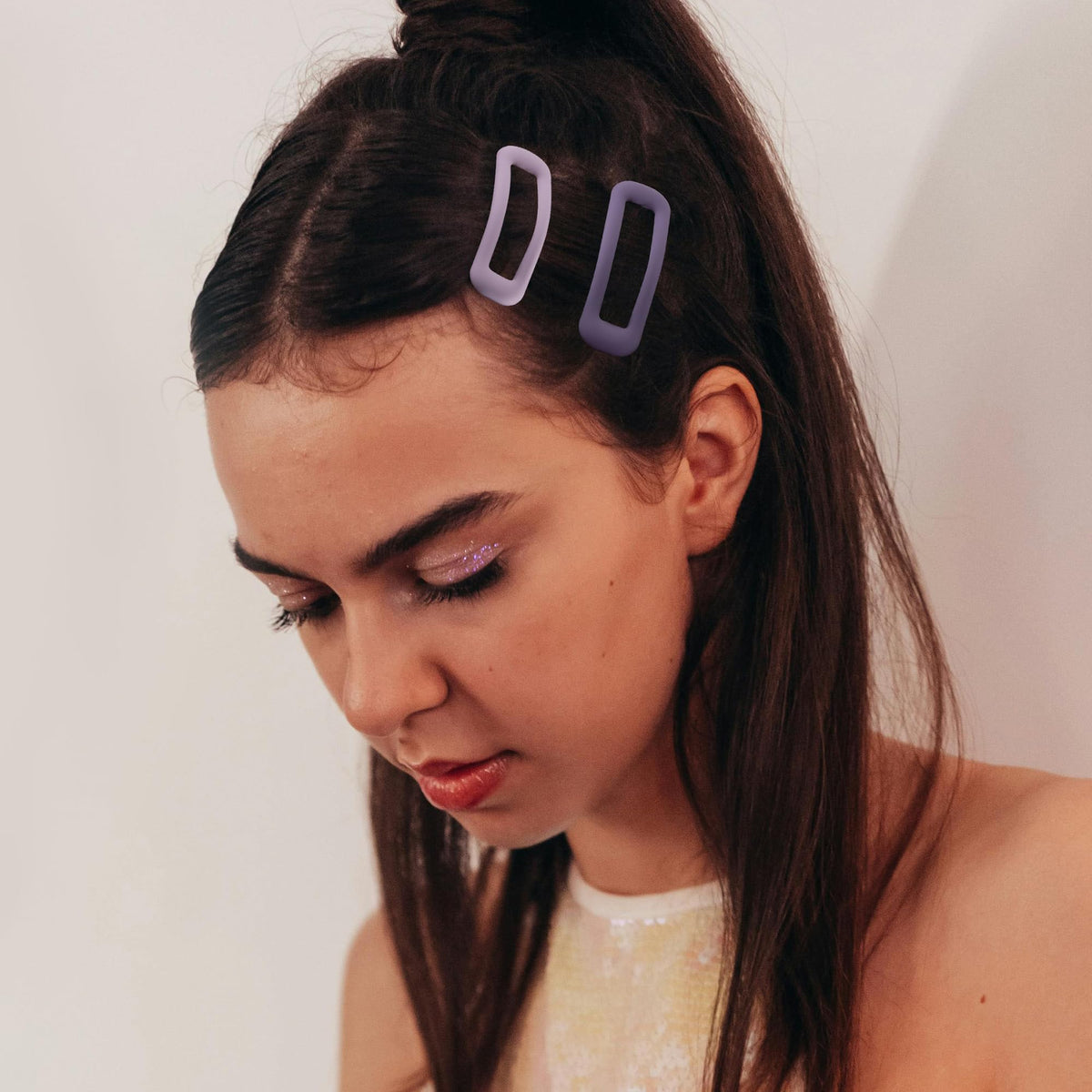 Cptots clip securing bangs demonstrating neat styling and secure hold