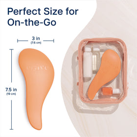Crave Naturals Glide Thru brush slipped inside purse for on-the-go convenience