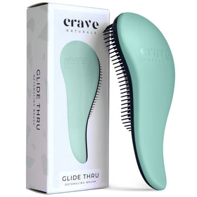Crave Naturals front view of turquoise detangling brush, easy identification and grip benefit